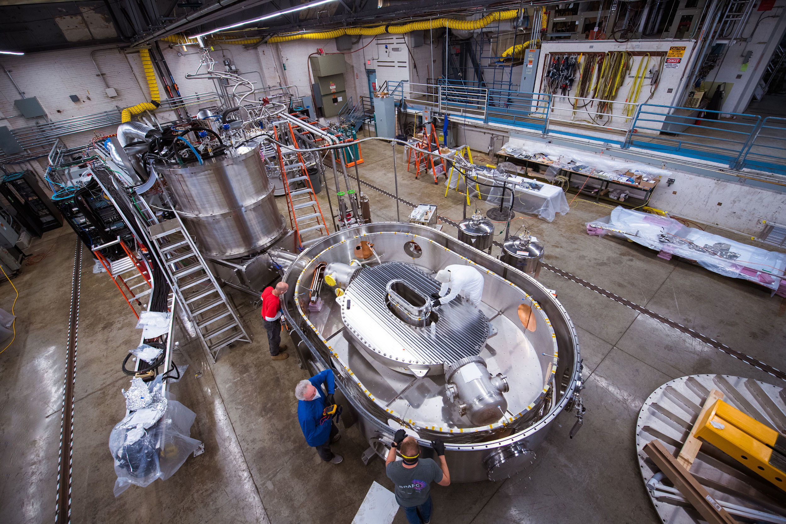 Four MIT researchers working on the magnet project for fusion power optimization