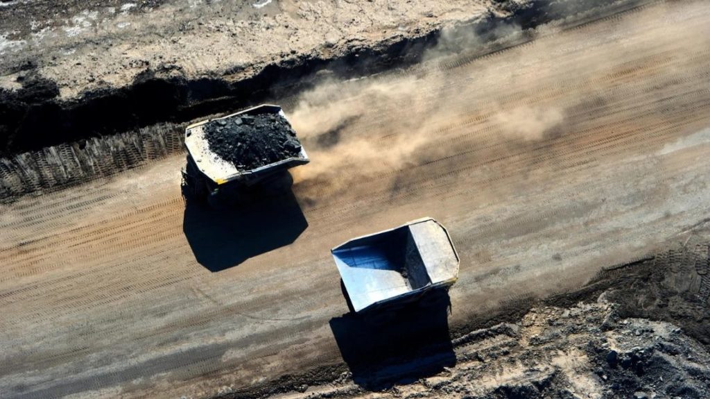 Caterpillar 797 dump trucks working at the Canadian Natural Resources Limited.