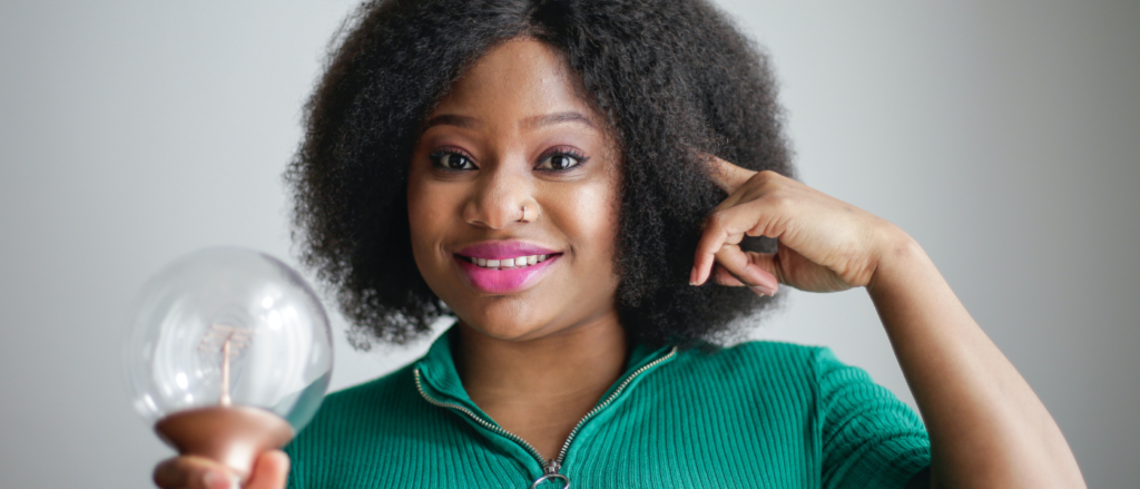 Young lady holding a object.