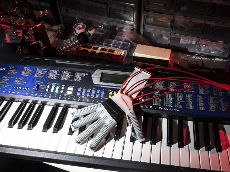 Special Gloves! Playing the Piano with Robotic Touch