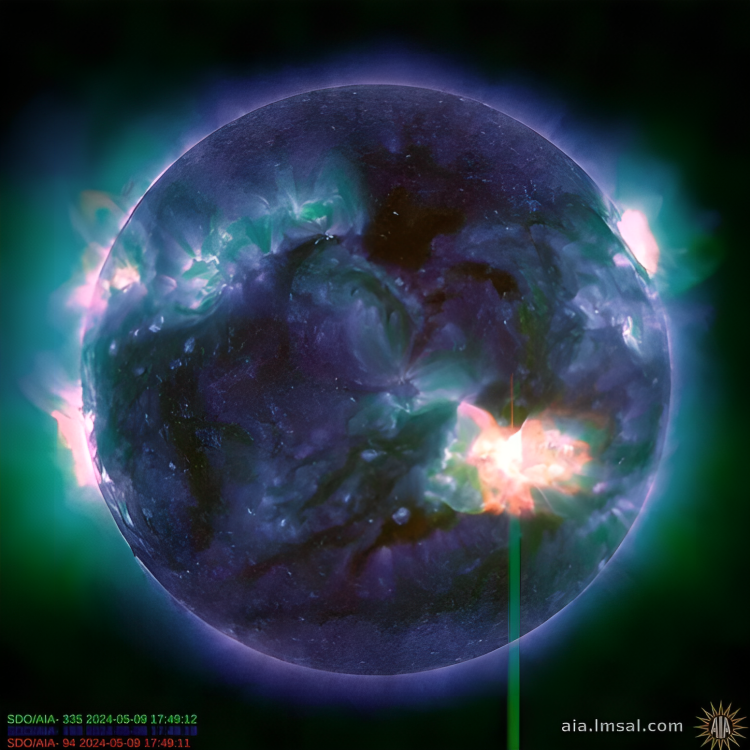 O Observatório de Dinâmica Solar da NASA tirou uma fotografia de uma erupção solar a 9 de maio de 2024. A imagem combina três comprimentos de onda de luz ultravioleta extrema para mostrar o material abrasador das erupções, colorido a verde, azul e vermelho.